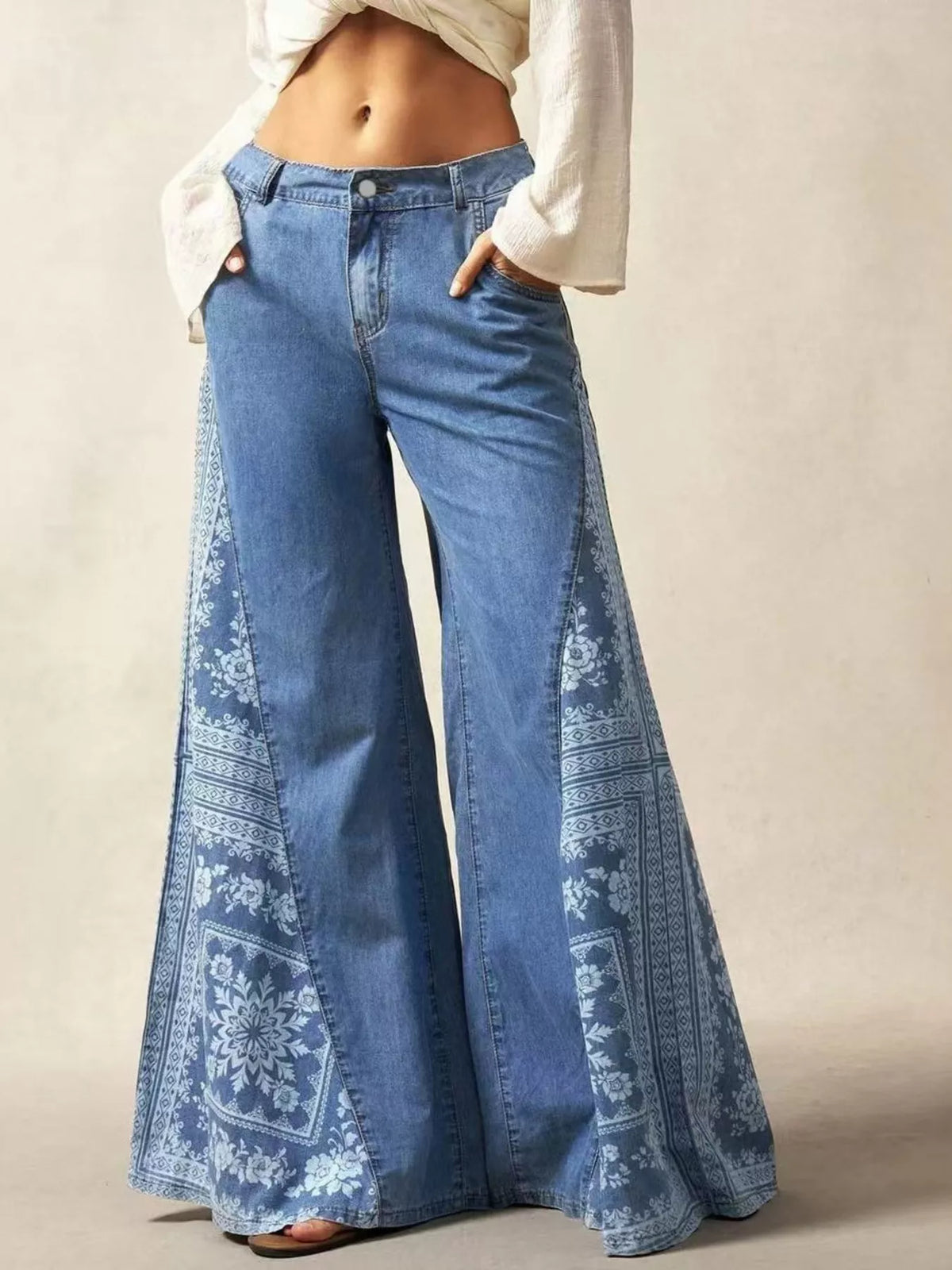 Wide-leg flare jeans in a blue floral print.