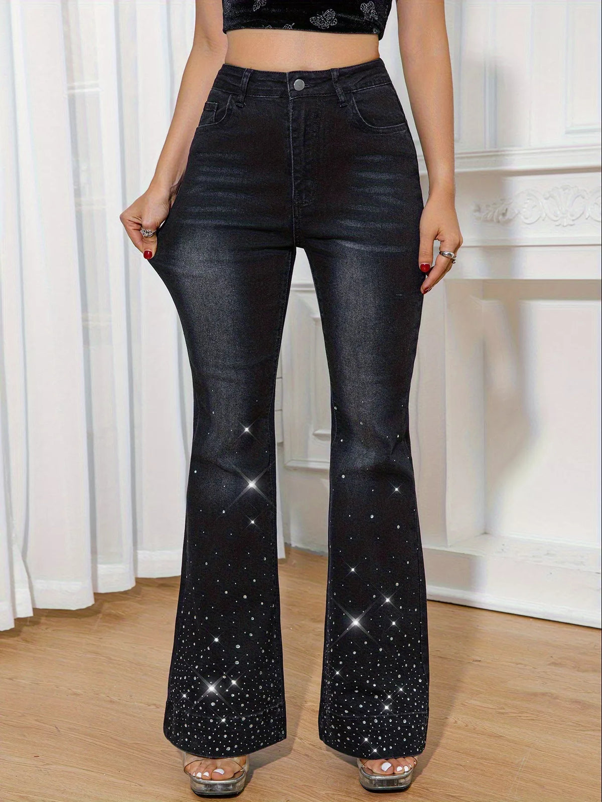 Black flare leg jeans embellished with rhinestones down the leg.