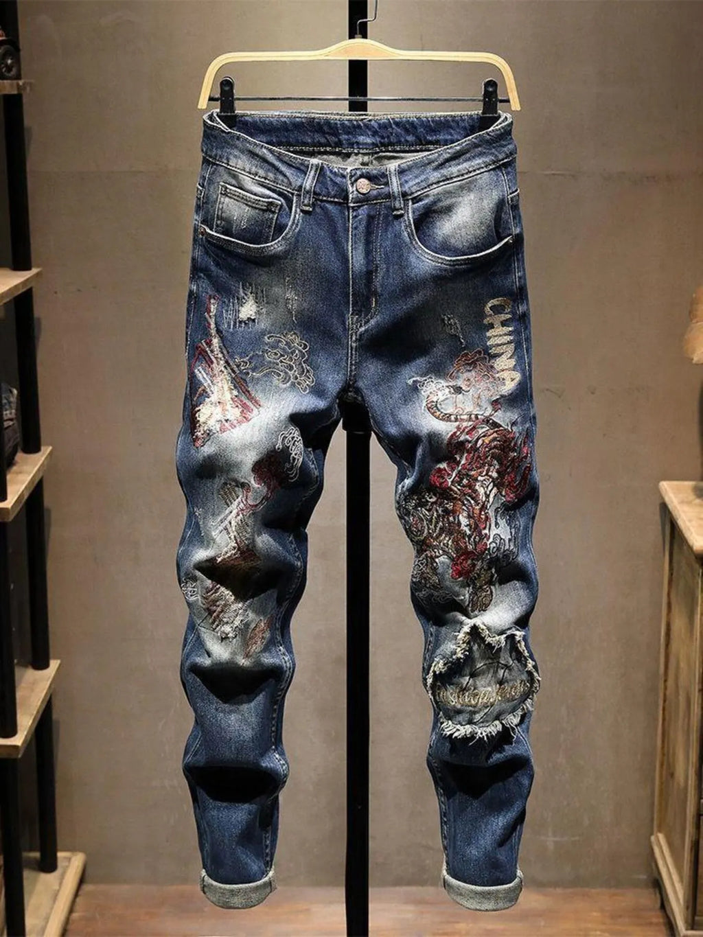 Men's distressed embroidered jeans