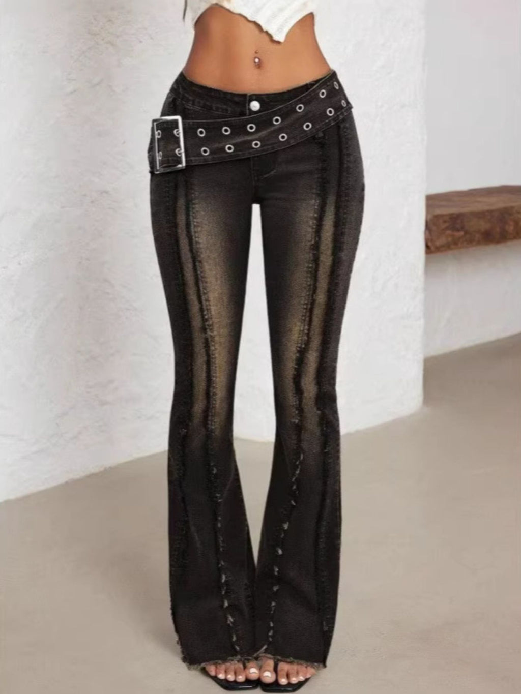Black high waist flare jeans with a matching belt.