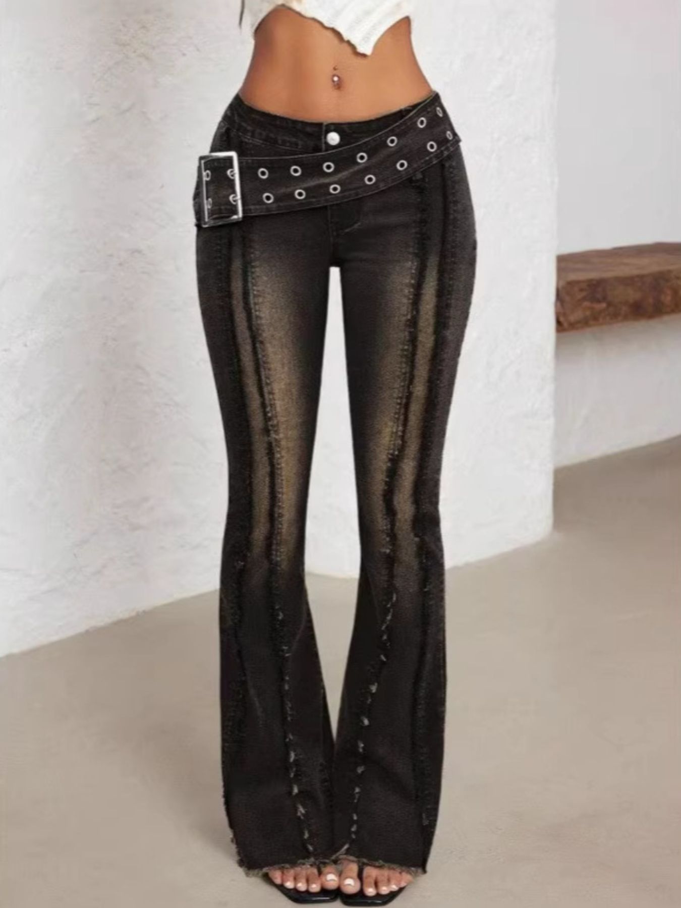 Black high waist flare jeans with a matching belt.