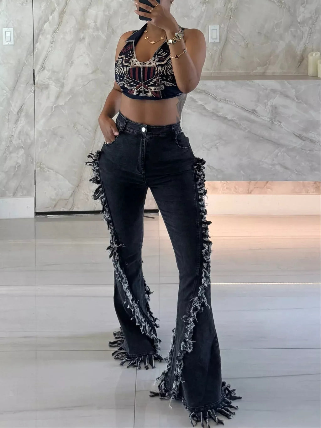 High waist flare jeans with frayed trim at the hem.