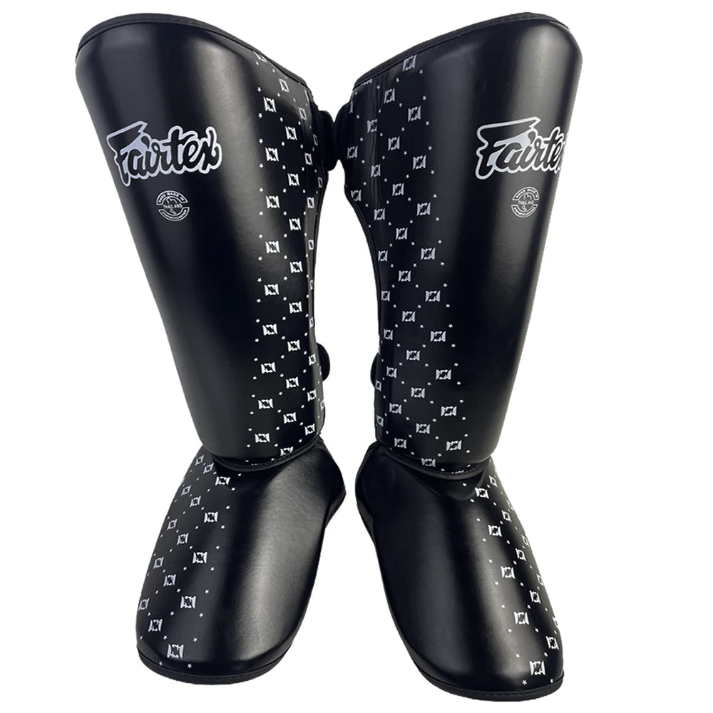 Kickboxing shin guards in black with built-in ankle protection